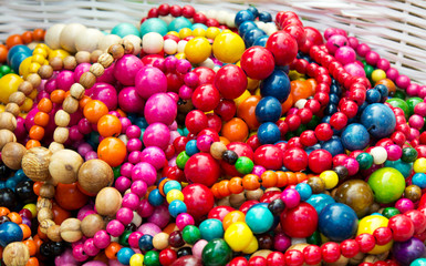 Ethnic wooden multicolored necklaces at market.