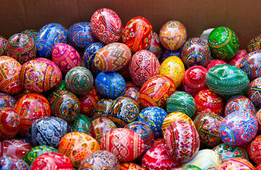 Fototapeta na wymiar Multicolored painted eggs at market, easter holidays.