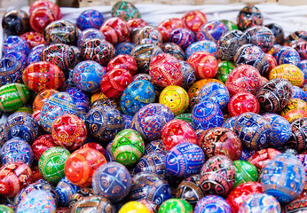 Fototapeta na wymiar Multicolored painted eggs at market, easter holidays.