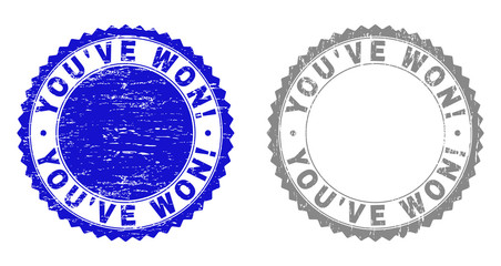 Grunge YOU'VE WON! stamp seals isolated on a white background. Rosette seals with distress texture in blue and grey colors. Vector rubber stamp imprint of YOU'VE WON! title inside round rosette.