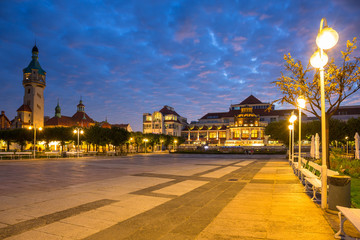 Fototapeta premium Lighthouse by the Baltic pier in Sopot at dusk, Poland