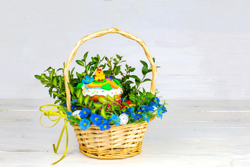 Easter cake and painted eggs, white flowers, festive composition in rustic style,ukrainian orthodox tradition, vintage wooden background, selective focus