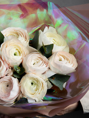 beautiful bouquet of flowers of peony roses, a beautiful gift for a woman, beautiful packaging
