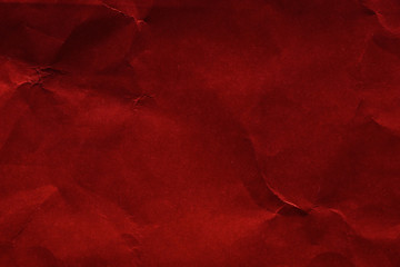 Texture and background of crumpled dark red paper. Empty template and mockup for designers.