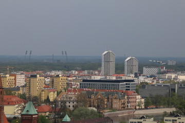 Warm, spring day in Wroclaw. View from the tower of the church of Saint Elizabeth to buildings, university, Odra river, blocks of flats, Olympic Stadium, dormitories. Wrocław, Breslau, Polen, Poland