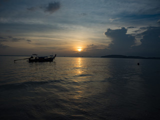 Fototapeta na wymiar Boat at late sunset