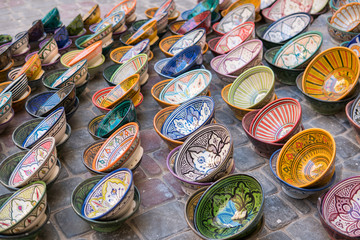 Raws of Colorful dish souvenirs for sale in a shop in Essaouira, Morocco