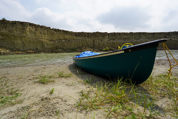 Canoe on the shore of the Milk River in Southern Alberta