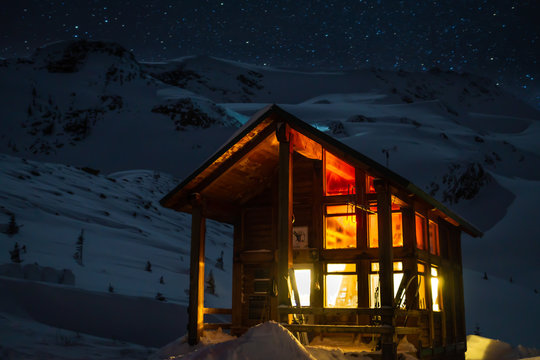 Backcountry hut, lit up at night in the Asulkan Valley of Rogers Pass