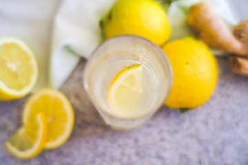 glass with lemon and ginger water