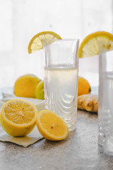 glass of water with lemon juice and ginger