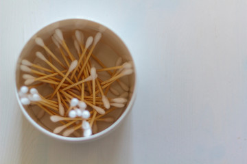 Top view of bamboo cotton swabs in a jar with copy space