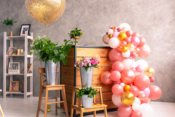 The workplace of the florist to work. Side view. Making floral decorations. Flowers on a old wooden table. Tools and accessories florists need for making up a bouquet.