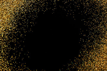 Frame made of gold glitter on black background, top view with space for text
