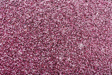 Texture of rose gold glitter as background, closeup