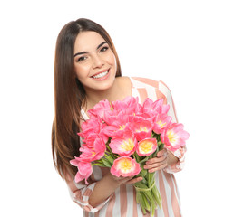 Portrait of smiling young girl with beautiful tulips on white background. International Women's Day