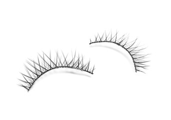 Beautiful pair of false eyelashes on white background