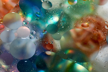 Fototapeta na wymiar floating in the water abstract colorful oil drops.