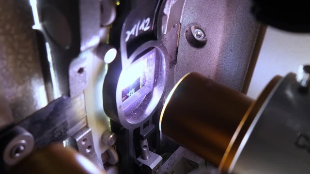Close up of a 35mm cinema projector in a movie theater