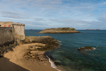 Beach, wall and fort in Saint-Malo on a sunny day in summer