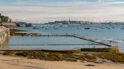 Beach of Dinard and old city of Saint-Malo in the background