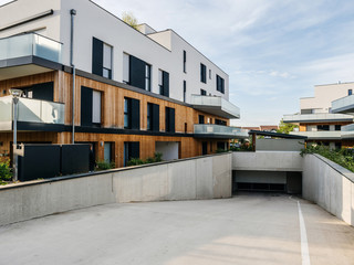 Large garage entrance under the new apartment building complex in French city