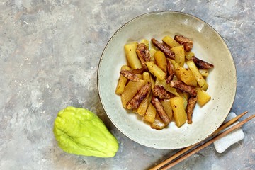 chayote with beef and sesame in asian style. The dish is popular in Asia, especially in Vietnam. recipe with chayote. copy space. place for text. top view