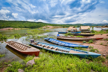 Colorful long fishing boat wooden in the river asia