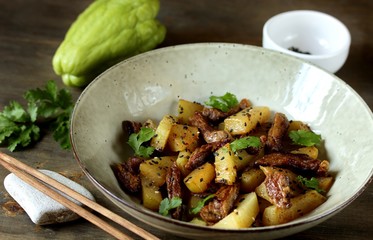 chayote with beef and sesame in asian style. The dish is popular in Asia, especially in Vietnam. recipe with chayote.