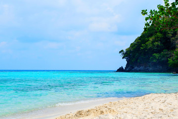 view of blue sea on the beach with sea rock wave on island