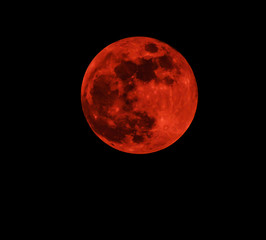Red moon real / full blood moon on black sky dark background - selective focus