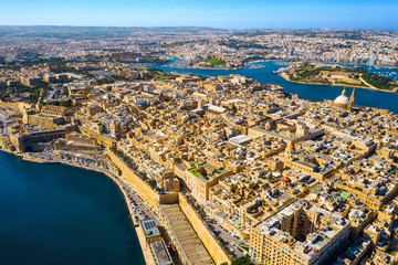 Fototapeta premium Aerial view of Valletta city - capital of Malta country, Manoel island and Sliema. Winter, Morning. Mediterranean sea.