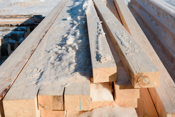 Timber at work. Lumber stockpiled. The boards are stacked. Boards for sale in stock.
