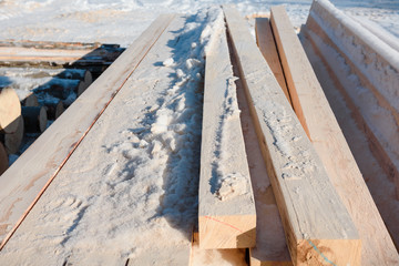 Timber at work. Lumber stockpiled. The boards are stacked. Boards for sale in stock.