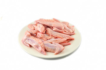 Fresh raw chicken wing on plate isolated on white background