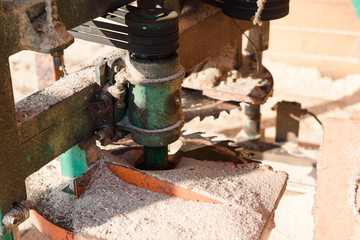 Woodworking Machine. Wood processing machines. Large tools in the sawmill. Lumber handling in winter.