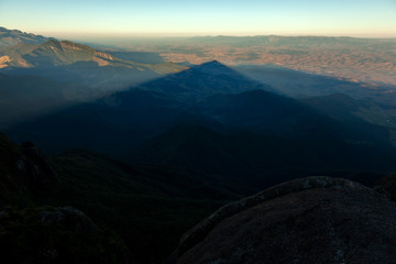Triangular shadows of a mountain seen from the summit in mantiqueira range - Brazil