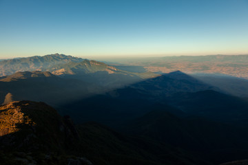 Triangular shadows of a mountain seen from the summit in mantiqueira range - Brazil