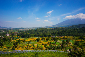 big mountain on the farming area with landscape scenery on tropical paradise country - photo indonesia