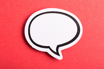 Speech Bubble Isolated On Red Background