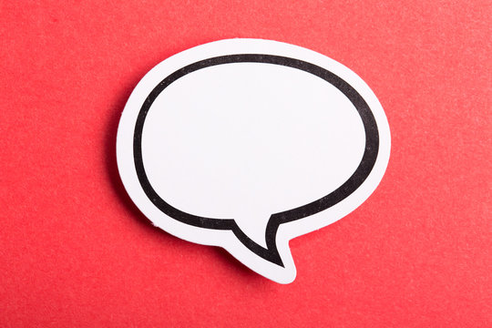 Speech Bubble Isolated On Red Background