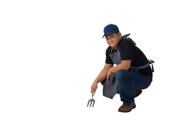 worker man or Serviceman in Black shirt and apron is holding Shovel for Cultivators isolated on white background