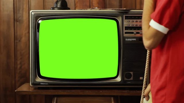 TV Transition Effect, Zoom into Old Television Set with Green Screen in Living Room to Piled Retro TV with Intermittent Green Screens. Two Clips in One.