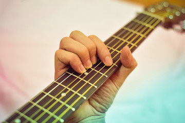 Fototapeta premium Guitar player / Hand man playing acoustic guitar in chord tab