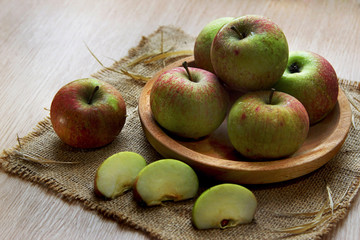 fresh apple on wooden bowl served on the table