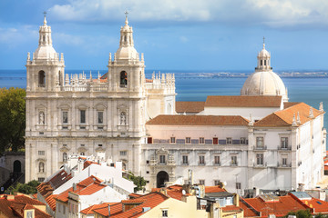 Fototapeta premium Sao Vicente de Fora Monastery, and the dome of the National Panteon (Santa Engracia church aka Panteao Nacional). Lisbon, Portugal