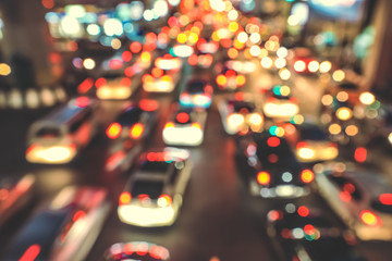 Blur traffic road with bokeh light abstract background