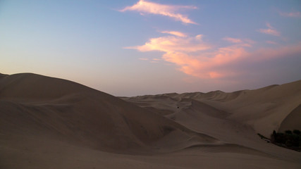 Fototapeta na wymiar Desert during sunset at Huacachina Oasis in Ica, Peru.