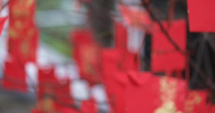 Defocused of red envelope Lunar New Year decorated. High-quality stock footage of red envelopes Lunar New Year decorated with text Happy New Year on red pocket. Tet Holiday concept, blurred background