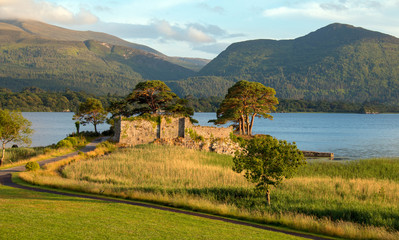 Ancient McCarthy Mor castle on Lake Lough Leane at Killarney on the Ring of Kerry in Ireland © htrnr